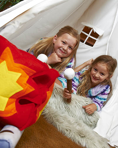 Camping in room with tent and camp fire