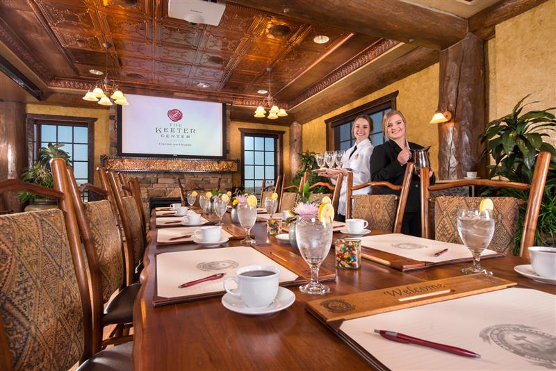 Two students standing in the The Joe N. Basore Presidential Dining Room
