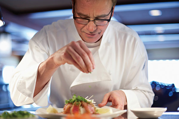 Chef Stricklin prepares a plate.