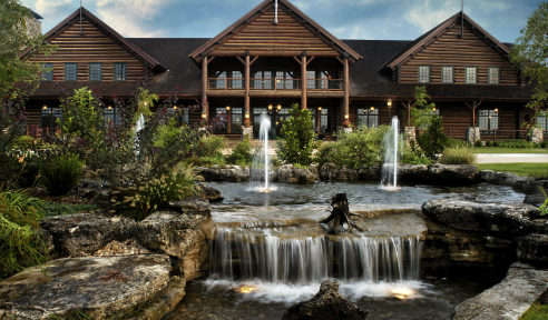 External view of the Keeter Center with water fountains and trees.