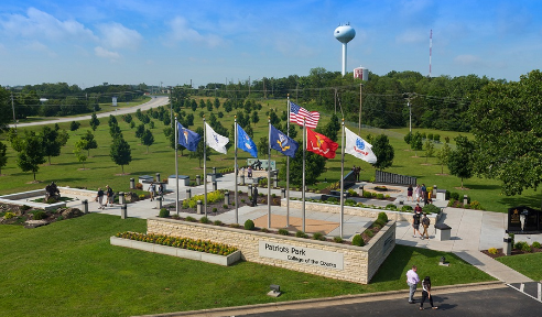 Areal view of Patriot's Park with the flags of all 5 branches of the military and monuments to honor those who fought in various wars.